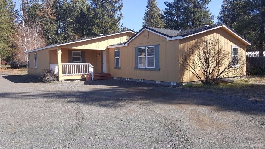 This home is located in a very private location at the base of the Lava Butte lava flow. This spacious home has fresh paint inside and out with newer roof and all new window coverings. Enjoy entertaining in the large great room with roomy kitchen, dining & living areas. Master suite is separate from the other three bedrooms. Oversized 28x30 detached garage is insulated and includes a pellet stove. The seller is offering a $2500 floor covering credit to buyers at closing.