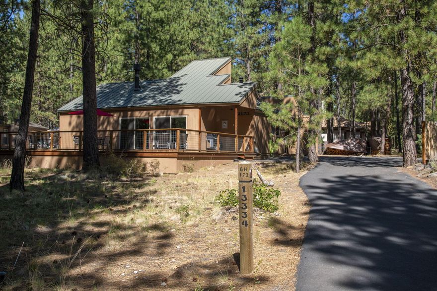 GH173 is a delightfully inviting Black Butte Ranch Cabin. It features a great room with a wood burning fireplace. The outdoors comes indoors with a wall of windows, and sliding glass doors that open to the large deck. The deck railing wraps completely around the deck. The main floor has 3 bedrooms, one is a suite with a private bathroom. There is a cozy and charming loft nook. 
For your fun equipment and practical items there is plenty of storage. GH173 has a strong rental history.  Amenities at Black Butte Ranch include  2 championship golf courses, tennis/pickleball courts, 6 pools, spa, restaurants with Cascade Mountain views or golf course views. 1800 acres offers miles of trails.