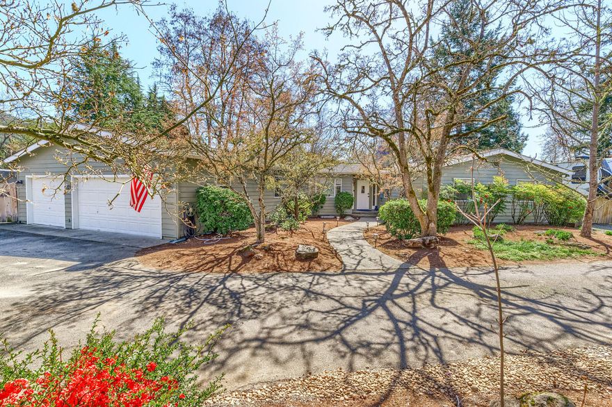 Your own Private Oasis in your backyard.  This beautiful 1.88 acres is the perfect Stay-Cation.  Gorgeous River frontage in the ''Clam Beds''.   Featuring a beautiful 4 bedroom; 2.5 bath home with 2619 sf.  Great room has a wall of windows to take in the great River and mountain views.  French doors leading to the deck, wood burning fireplace and wood floors.  Spacious kitchen with newer SS appliances,  Range/Oven with gas cooktop, wine fridge, veggie sink,  island with seating, formal dining  and laminate flooring.  Family room/office area with fireplace and French doors to the deck.   Large Primary bedroom with en-suite bath, walk-in closet, window seat with storage and French doors leading to the deck and relaxing hot tub.  An attached 3 car garage with 942 sf.  R/V parking and circular drive.   An amazing play structure stays  for hours of fun.  Convenient location close to schools and shopping.  District 7 schools.   A rare find in the city.  Don't forget your fishing pole.