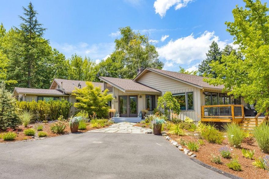 Serene and versatile home in a pastoral setting. Inviting one level floor plan. Spacious living room with sweeping views of the property and surrounding hills through a wall of windows leading to an airy front deck. Cozy fireplace with sitting area and breakfast nook. Hardwood floors throughout living areas. Enjoy the expansive kitchen with picture window, bar seating and ample counter space. Neighboring walk-in pantry for all your storage needs. Open kitchen, dining and family room bring guests and family together. Right off the kitchen, you will find a cozy covered outdoor living space. Large master bedroom with an en suite bath with jetted soaking tub. Sliding doors off the master lead to a private side deck with hot tub. Separate studio cottage adjacent to the garage. The cottage has a full kitchen and bath with views of the back pasture from the adorable private porch. Heated two-story shop. Paved RV parking. Landscaping by Solid Ground Landscaping. TID Irrigation.