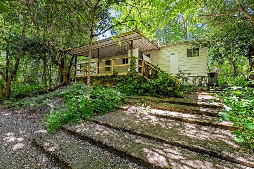 Beautiful Creek front property located in Wilderville, on Slate Creek. Mostly level to rolling with 2.5 acres, with a mixture of trees and open meadow.  There is a 1977 manufactured home that has 2 bedrooms 2 baths, with 1152 SQFT, needs some tlc and is sold ''As-Is''.  Well and septic, can also purchase an adjacent property address 9175 Redwood Hwy for $130,000.00, makes for a great 2-family set-up.  A great opportunity.  Don't miss this gorgeous piece of property. The neighboring property located at 9175 Redwood Hwy is also for sale for $130,000.