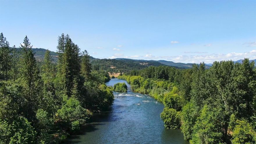 Sellers Motivated! 450-Feet of Rogue River frontage on this 9-acre wooded lot. This 1991 Pagnini remodel features 4-bedrooms, 3-bathrooms, 3,604 sq. ft., daylight basement, oak hardwood floors in kitchen, granite kitchen island, tile countertops, fireplace in living room, upgraded central vac, master bath with jetted tub and marble tile shower and tile all around and laundry room with bathroom. Several outbuildings including 1-bedroom guest house, 2-car garage, 3-auto shops (fully insulated), 3-phase electric to shop area, 2-carports, 2nd story hobby room with half-bath and half-kitchen, tub house greenhouse, 5-person hot tub, 2nd greenhouse at garden, concrete pad by river for entertaining, large yard (river irrigated), good well per owner. TOO MANY amenities to list!