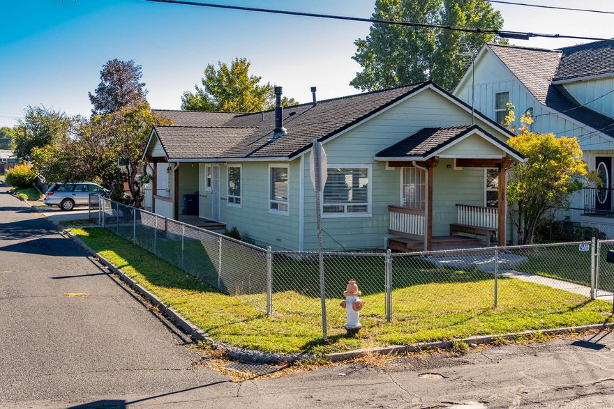 Welcome to this beautifully updated home in the heart of Prineville! Originally remodeled in 2006, this charming 2 bedroom, 1 bath , 884 sq ft cottage features modern updates throughout, including fresh carpet, paint, a stylish kitchen, new siding plus great garage. Comfortable spacious living room heated with gas freestanding stove plus forced air and HP for AC only. The fully fenced yard offers privacy and functionality, complete with a large side gate for access to the enclosed area perfect for storing all your toys and RV's, has a full RV hookup. A breezeway connects the home to a spacious detached double-car garage, adding convenience and lots of storage. Landscaped yard with a hand-driven well, perfect for irrigating the lawn (no pump is installed). This property combines comfort, practicality, and location—don't miss your chance to make it yours!