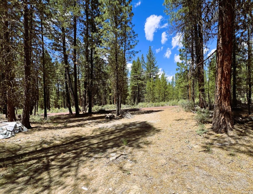 This 1.02-acre ''campsite-ready'' corner lot in the Sprague River Pines Subdivision offers a fantastic opportunity for outdoor enthusiasts. The property features an established circle drive with gravel and partially cleared area, providing easy access and convenience. Located close to the main highway, this lot is ideally positioned and is close to the Williamson River w/subdivision's private access for all your recreational pursuits. With no association fees and CCRs in place to maintain the property's appeal, this lot is only 15 minutes from Chiloquin, making it both accessible and desirable. Don't miss the chance to make this one your own.