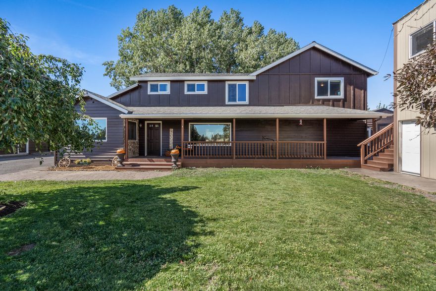 Come see this perfect small acreage with endless possibilities in Bend, Central Oregon's dream mountain town! Lovingly curated over the last 14 years, the owners have continuously improved the 9.98 acre property, its fenced pastures, outbuildings & barn. The original home is remodeled and transformed into a larger 4 B/3ba traditional with a media/bonus room, knotty alder doors and trim & hand scraped birch floors in the primary suite. A newer detached structure with hardwood floors & tongue and groove pine ceilings makes the perfect office. A 2-story metal shop building is ideally situated adjacent to the house & does double duty as shop garage for all your toys below & the upper level work space with multiple rooms has great flow, perfect for welcoming clients to your ''work from home'' based business! The barn with four paddocks, a large irrigated pasture, four smaller pastures, hay storage garage & animal shelter for goats/dogs rounds out the property. 4 acres irrigation