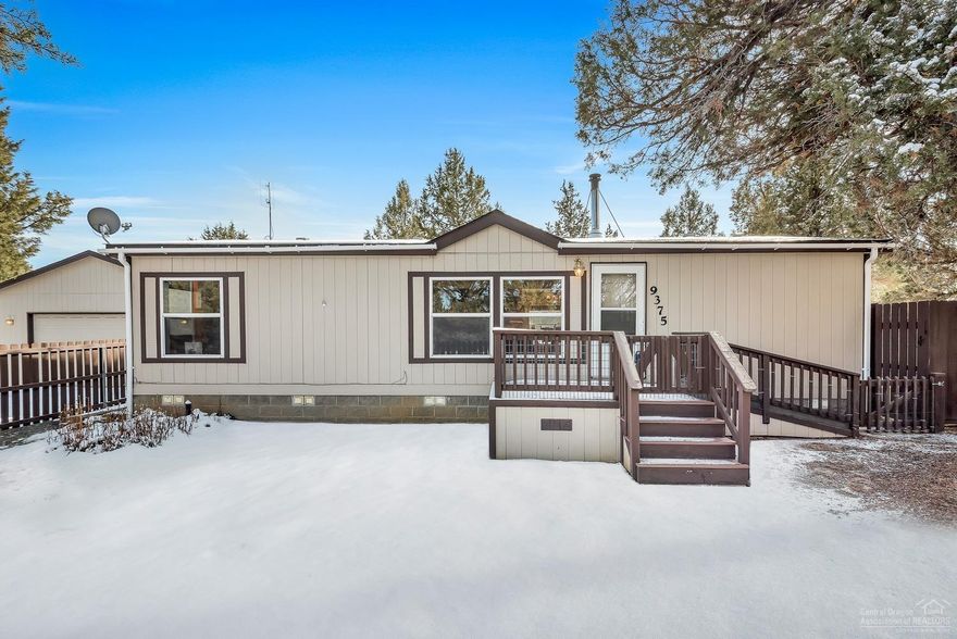 Horse lovers this is the property for you! Cute home sits back off road on a treed lot for privacy. 1.39 acres fenced & cross-fenced. Backs up to BLM with access to horse trails & hiking trails. 3 horse stalls include padded floors & electricity. Open floor plan w/vaulted ceiling. Big windows for natural lighting. Bedrooms on opposite ends of home. New wood stove 2016, new roof & gutters installed 2017. Detached over-sized, heated, 2 car garage includes 2 rooms w/heat & A/C, hot & cold water. Must see!