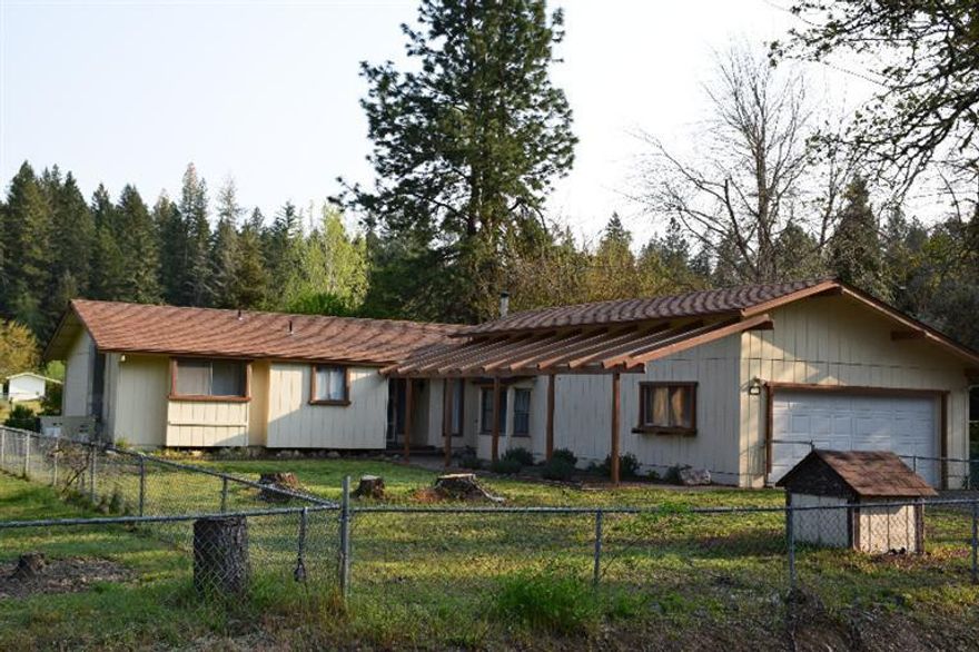 Looka Home on acreage with a large shop, at $249,500! Remodeled 1586 sq ft, 3 bedroom 2 full bathroom home on 1 level acre with a 30x 50 shop & chicken house ready for occupancy. The extra-large family room is accented with a wood stove & large picture windows and ready for you entertaining and holiday festivities. With a covered back porch, you have a perfect late afternoon sitting area to rest or get ready for working in your garden. And there is a play room just off the kitchen, ready for a pool table or the kid's tricycle speedway. The fenced back yard is just right for kids or pets to explore the outdoors without getting out of view. The double garage allows parking for the cars, because you also have a 30 x 50 work shop, complete with a garage door for the larger projects and a separate room for the smaller jobs or storage. The crowing rooster will appreciate the hen house or let the gardener use the shed as a tool storage. This property has something for everyone.