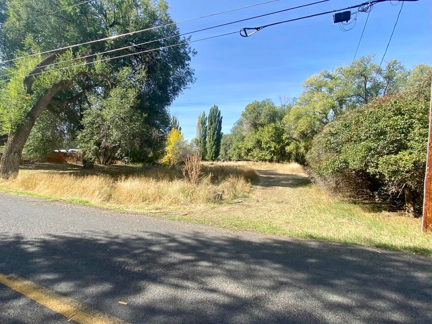 One-acre level lot located towards the end of a dead-end street in the suburbs of Klamath Falls. Close to shopping and the Sports Complex.  Zoned RM (Medium Density Residential) so can build a duplex, single family residence, or shop. Manufactured homes allowed. Nicely treed and level. Call Klamath County Planning for any questions on zoning, allowed structures, number of animals, etc.  Utilities located at the street.