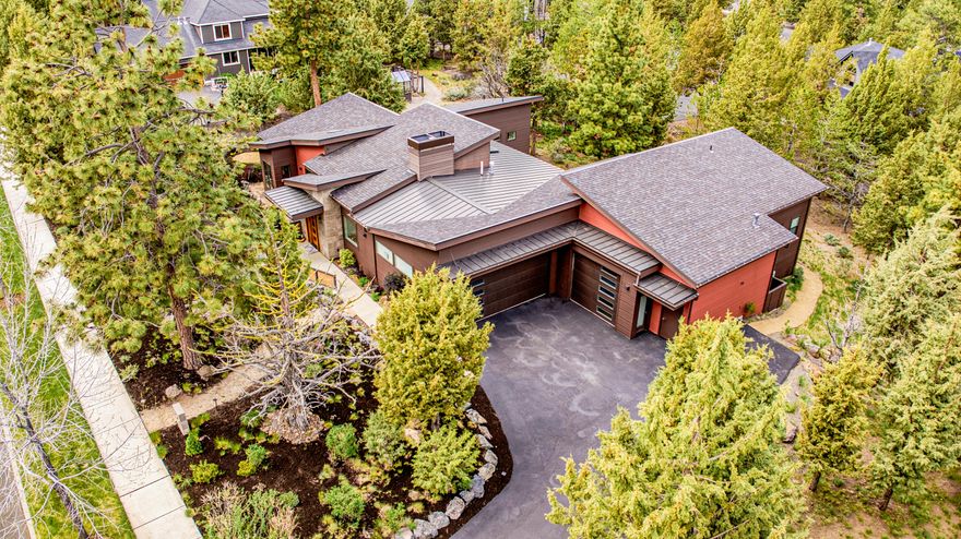 This is a distinctive dwelling that was expertly crafted. Truly a cut above the rest in quality, design, and attention to detail. It's also a car lover's dream capable of storing 6 cars thanks to high garage ceilings that accommodate 2 car lifts, plus the 2 car commuter garage. Well-laid out cook's kitchen presents a pot filler, convection oven and micro, center island, and striking walnut cabinetry. Light-filled dining room was designed to host large gatherings and offers a lighted liquor cabinet atop a bar with two beverage refrigerators. There's also a place for your favorite pub table in the nifty corner alcove. Each bedroom is ensuite and the guest bedrooms are located on a wing opposite the primary. Covered back patio is very private and has built-in heaters and sound. Sited on a huge .58 acre flat lot on a dead-end street. The ideal setting for those searching for quality & quiet. Close to the River Trail.