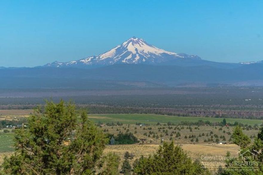 Great one level home with spectacular views of Mt Jefferson & the Three Sisters Mountains! Wrap around deck. Mature Landscaping. Home features vaulted ceilings & propane stove in the 16x23 Lvg Rm. Lg country style kitchen with double ovens, 13x11 Dining area off the kitchen. 14x17 Master Bedroom with large master bath & walk in closet. Master bath has step in shower/soaking tub. Forced air electric furnace. 24x24 Detached Dbl Garage. New Roof 2016. Just minutes to Lake!