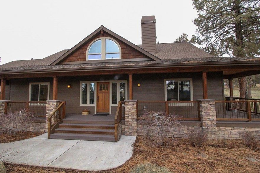 The living is easy in this handsome one level home located at the Running Y Ranch. Over 2300 square feet, the great room plan with split bedrooms, provides separation of space, for added privacy. Your eyes are drawn through the soaring great room with wood ceiling to the glass French doors and outside to the covered patio and beyond. Outdoor living spaces surround the home, allowing more outside leisure time through the seasons. Both baths have tile floors, tile counters and separate custom showers and polymer tubs. The kitchen, with center island and Corian counters, makes gourmet preparations a breeze. AND, the garage is the car aficionado's dream. The 31 x 35 ft. space is a three car garage with tandem spacing for 4 smaller cars. Laminate flooring transitions seamlessly through the great room, dining and kitchen areas and hallway. There is even a dog kennel for the pouches. Many more amenities.. come view this home.