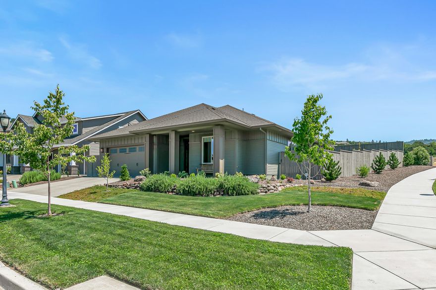 Practically new single-level home on a large corner lot in the desirable Summerfield neighborhood of East Medford! High ceilings, wide-plank engineered hardwood floors, living room with ceiling fan and renovated gas fireplace, dining area with sliding glass door to covered patio, kitchen with quartz dining island and counters, soft-close maple cabinets, tile backsplash, walk-in pantry, stainless five-burner gas cooktop, convection oven, built-in microwave, dishwasher, and refrigerator. Primary with ceiling fan, glass door to back patio, full ensuite bath with walk-in closet, tiled floor and shower surround, quartz double vanity, and water closet. Two guest bedrooms with closets and full bath with solar tube, quartz vanity, and tub shower with tiled surround. Laundry room with built-ins, utility sink, washer, and dryer. Two-car garage with pull-down ladder to attic storage. Fully-fenced private backyard with ornamental trees and sunny gardening areas. Inquire for details!