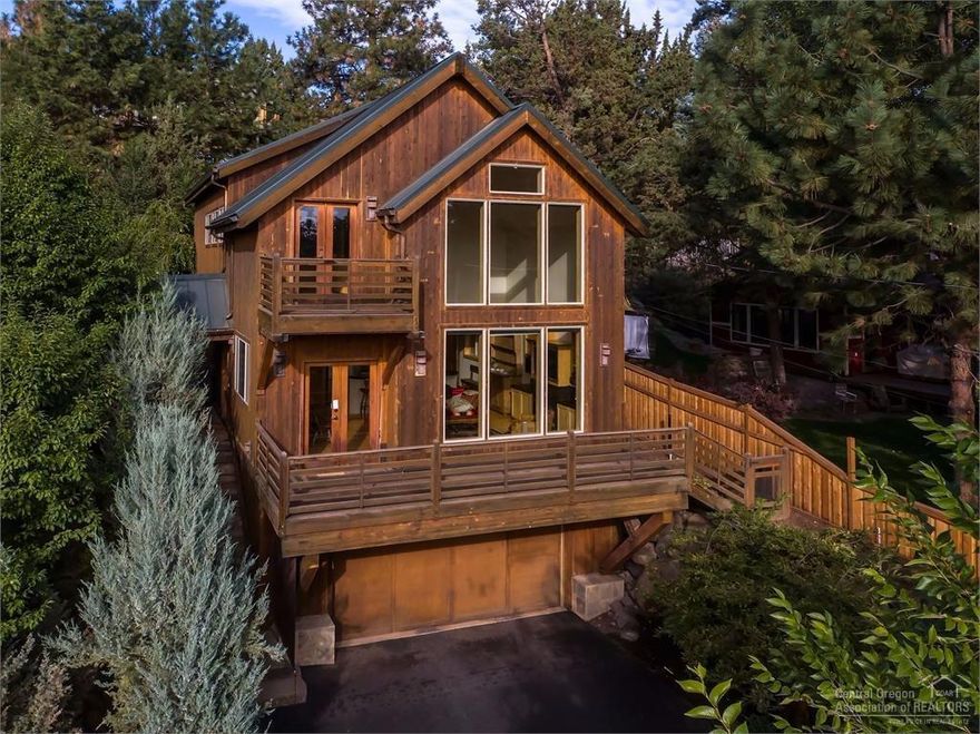 Imagine a place you've only dreamed about!Amazing custom home built in 2003 w/the highest quality finishes possible.Picture yourself basking in the beautiful sunlight streaming through your floor to ceiling picture windows as you look out to capture sweeping Bend views.Enjoy an open floor plan that boasts hickory hardwood floors,alder cabinets,granite countertops&stainless appliances.You will love the finished garage storage&professional landscaping.Don't miss your opportunity to own this private oasis.