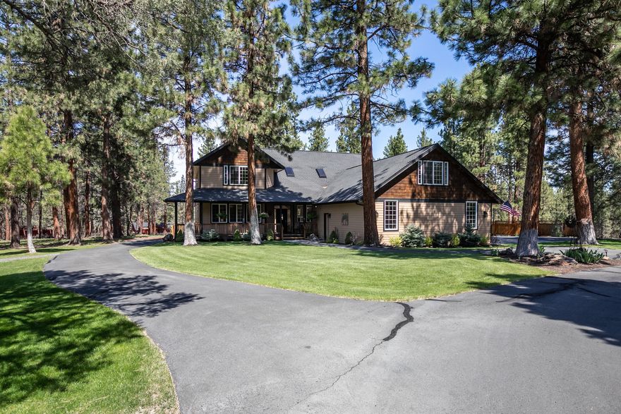 Beautiful 4 bedroom 3 bath with bonus room over the garage, large laundry room meticulously cared for in every way. All  newly updated. With solid surface counter tops and stainless steel appliances, refrigerator included.  The Primary room is on the main floor and boasts its own private entrance, along with a large tile shower.  The property is on nearly 2 private acres with mature ponderosa trees, open grass areas, and shrub beds. Thoughtfully landscaped and well cared for. Large front and back covered decks for enjoying the outdoors in all year.  Large shop - with ample RV parking. The garage has lots of built in cabinet storage.  Riding lawn mower included in sale.