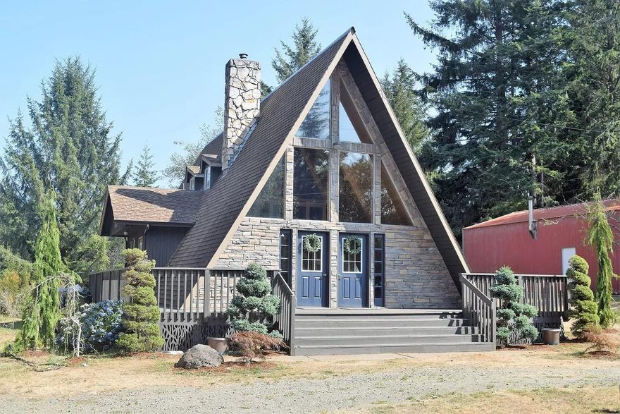Experience the beauty of the PNW indoors & out, in this unique, completely remodeled, move-in ready  A-frame home.  Boasting a stone exterior, 20' natural pine ceilings & woodwork, an overlooking loft area with metal accents, huge windows to bring in floods of natural light, floor-to-ceiling fireplace, quartz countertops, hickory cabinetry, custom tile backsplashes & tub, luxury vinyl plank flooring, new carpet & all new light fixtures, this house & quiet neighborhood provide a peaceful environment to call ''home''.  Wrap around deck, balcony off master bedroom, raised garden beds & beautiful landscaping & fruit trees adorn the usable, completely fenced-in 1 acre lot.  
739 sq ft insulated garage w/ office & workshop area, 20 x 40 metal shop w/ concrete floor, loft & electric & metal wood shed filled w/ wood for this winter.  Each bedroom has a separate outside entrance, making this the perfect home to use as a vacation rental.
6 miles N of N Bend, less than a mile from HWY 101