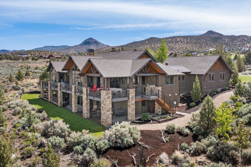 This stunning 4500 Sq Ft, 4 Bed, 3.5 BA Northwest style home is perfectly situated to provide unforgettable views of the 15th green and Hole 16 at Brasada Canyons while offering unfettered panoramic views of the Cascade Mountains to create the perfect bespoke Brasada backdrop. 
Unmistakable craftsmanship and quality of materials abound as you enter into the open, vaulted great room and warm kitchen/dining area. Step outside and you will find a deck that spans the length of the entire home. The deck area features a large covered portion with a gas firepit and outdoor kitchen. Coupled with the aforementioned views, this outdoor living experience is virtually unparalleled. 
The primary bedroom offers vaulted ceilings and a cozy fireplace with direct access to the deck hot tub. Adjourn downstairs and you will find a media/game room complete with a fully outfitted bar and a walk in wine room, perfect for tastings. Two additional bedrooms and a bunkroom complete this wonderful home.