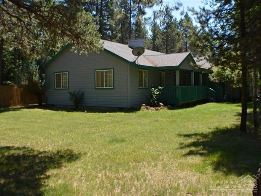 Single level home on .65 of an acre located in The Pines. Landscaped yard with nice grass area, the walkway is pavers & leads to a covered front porch. Enter the open greatroom w/wood burning wood stove slate surround, built-in entertainment area, wood floors, granite island w/Jenn Air cooking oven & maple cabinets. Large covered deck off the master BR and a open area with hot tub, paver patio out back leading to the wood shed, private setting w/tall fencing out back, close to Sunriver & High Cascade Lakes.