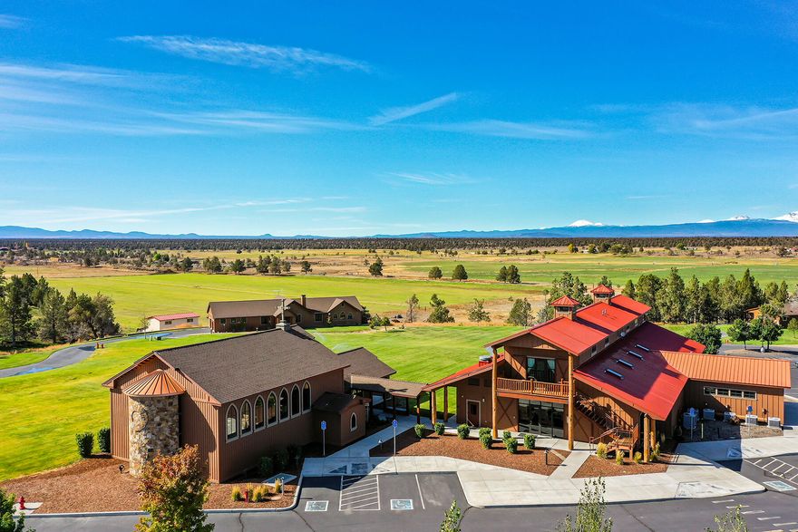 A once-in-a-lifetime opportunity awaits you in the wide-open expanses that exist just east of the popular destination town of Bend, Oregon. With pristine mountain views, multiple buildings and dwellings, and 25 acres of irrigated land, this 37.89-acre property is the perfect family estate or compound. The 3 bdrm/3.5 bath main residence anchors the living spaces and overlooks the expansive landscape with beautiful mountain views from the wide kitchen windows and wrap-around porch. Five duplex cabins, each about 500 sqft, provide additional living space. For family members and friends on the go, there are 7 RV spots with hook-ups. 
Additional buildings include a 8,639 sqft conference center and commercial kitchen, and a 3,016 sqft chapel offering opportunities for large gatherings, meetings and celebrations. 
Located between Pronghorn Resort and Brasada Ranch, just 30 minutes from downtown Bend, this property provides vistas and tranquility as well as modern amenities.