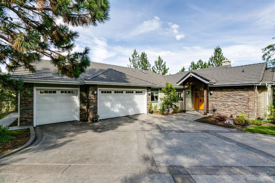 Amazing custom built home overlooking the Deschutes River & River's Edge Golf Course. Open floor plan with floor to ceiling windows, vaulted ceilings and Brazilian cherry floors. Chefs kitchen with solid cherry wood cabinets, granite counters, stainless steel gas appliances, breakfast bar and antry. Master suite with a tiled shower, soaking tub, and large walk in closet. 2nd master bedroom has full bath, wet bar, and a private deck. Three car garage with extra shop area and huge partially finished storage area under the house. Enjoy river views from the wrap around deck with hot tub and covered area for year round outdoor living. The backyard features a koi pond, private seating area and direct access to the Deschutes River Trail.