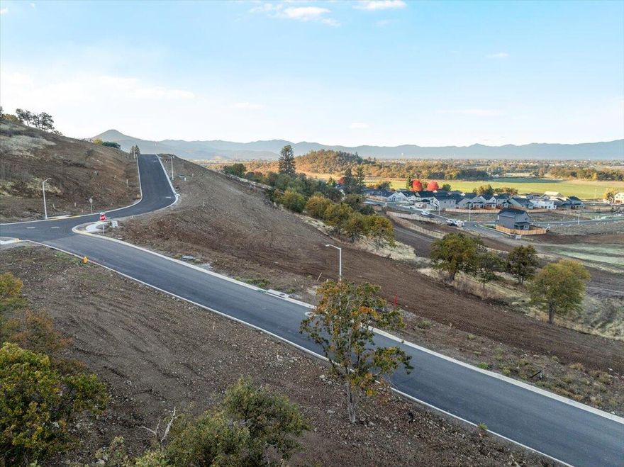 Introducing Quail Run Estates, Eagle Point's premier new subdivision of large luxury estate lots. Discover a rare opportunity to build your dream estate on one of these generous 1-acre view lots, perfectly situated overlooking the renowned Eagle Point Golf Community. These elevated home sites boast breathtaking, panoramic views of the golf course, surrounding mountains, and Rogue Valley. This is Lot 75