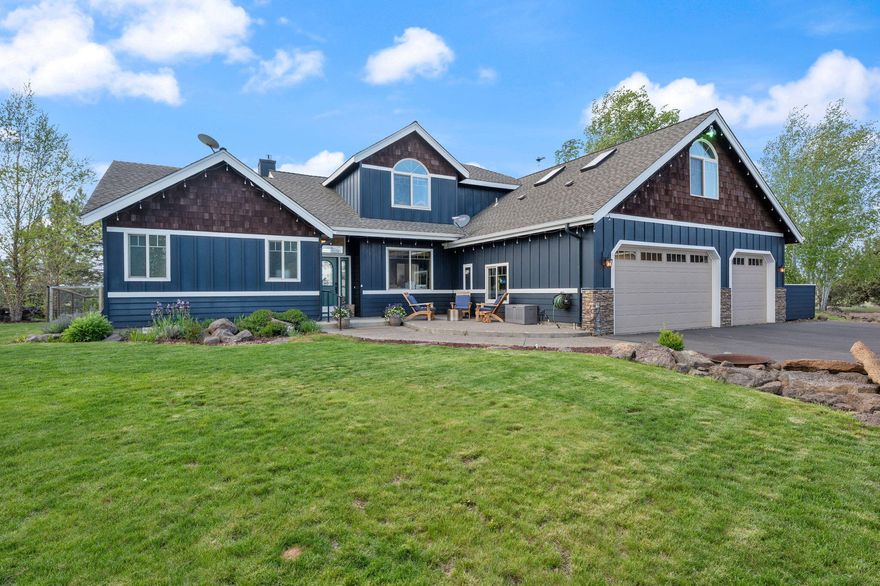 Experience the Best of Central Oregon Living! This exceptional 20 acre property offers rural life tranquility minutes from town & unobstructed panoramic Cascade Mountain views. Spacious 3,044 sq ft home is thoughtfully designed featuring 2 luxurious primary suites on main level-Perfect for multigenerational living or guests. Fresh interior paint throughout & expansive picture windows that flood the living area w/natural light & showcase the stunning landscape. Vaulted ceilings enhance the airy, open feel, while the kitchen boasts refinished concrete countertops & new backsplash. Upstairs you'll find two additional bedrooms, full bath, & versatile bonus room-ideal playroom, office, or media room. The property offers a 3-car attached garage & detached 1,000 sqft shop with ample space for RV parking, farm equipment, or hobby workshop. Additional RV pad w/full hookups. 14.8 acres of irrigation rights, pressurized underground sprinkler system & K-lines. Four serene ponds & 9 hole disc golf