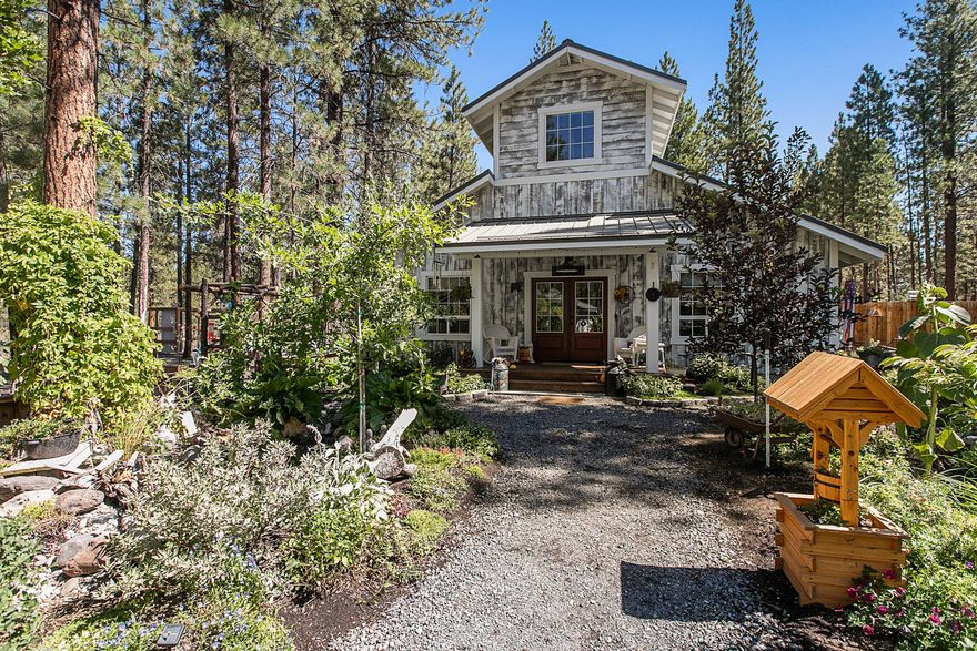 Barndominium at it's finest! Multi-generational living is a great option here. A new home with incredibly artistic Rustic Farmhouse Cottage Design. You can live on one side and use the other for family or whatever your imagination can come up with. Or you can have the pantry removed for use of the entire space. A very creative guest quarters made from Silo (350 sq ft) keeps this little gem constantly occupied. You will find 2 cute water features with fish in your private backyard oasis. 2 Greenhouses with rocket mass heater and redneck pizza oven in one, a poultry complex, multiple garden areas amongst the gorgeous Ponderosa Pines, a nice shop 24x36 and an 8x8 shed all within this fantasy land fully fenced in. Come soak in the atmosphere of this divine home.