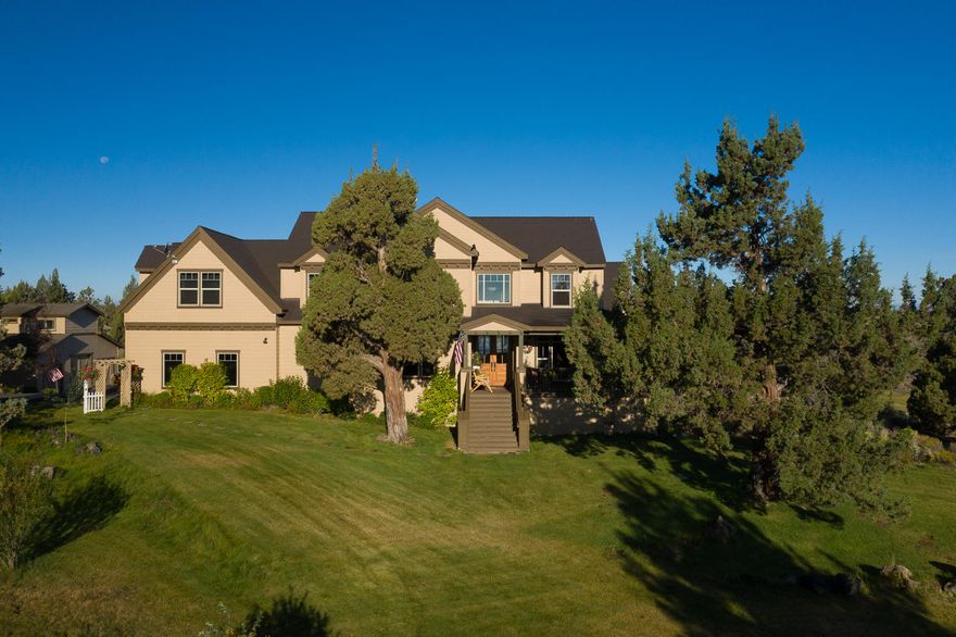 Peace, tranquility and lots of elbowroom & still just minutes from downtown Bend, Oregon! This amazing family home sits on 25 private acres with breathtaking Cascade Mt and seasonal canal views. There is also a view of the historic C-4 Ranch barn! The land surrounding this custom home is beautifully landscaped and must be seen to be appreciated. Upscale finish work throughout the home and a dream kitchen with stainless appliances and double ovens. Massive island made from ancient Sequoia Redwood tree caps-off the amazing kitchen.  Great room concept with floor-to-ceiling stone fireplace & efficient pellet stove with mantle made from 1,000-plus year old Juniper tree. 480 sq ft living area above spacious shop building is great for generational living. Room to park 4 cars as well! EFU zoning affords a multitude of land uses.  Come and see this beautiful Central Oregon hideaway.