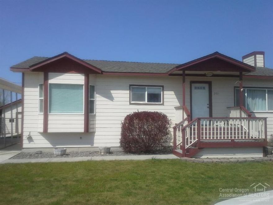 Charming, tastefully updated and immaculate 3 bedroom home bordering Ochoco Creek. Hardwood flooring in living/dining and hall, tile in kitchen and entry and bath. Fresh exterior and interior paint. Natural gas fireplace keeps it cozy. Spacious covered deck through the French doors, invites relaxing and listening to the creek ripple by. Back is completely cyclone fenced (recently), tall carport, small shop with lean-to and dog kennel with covered area. Yard is landscaped, includes sprinkler system.