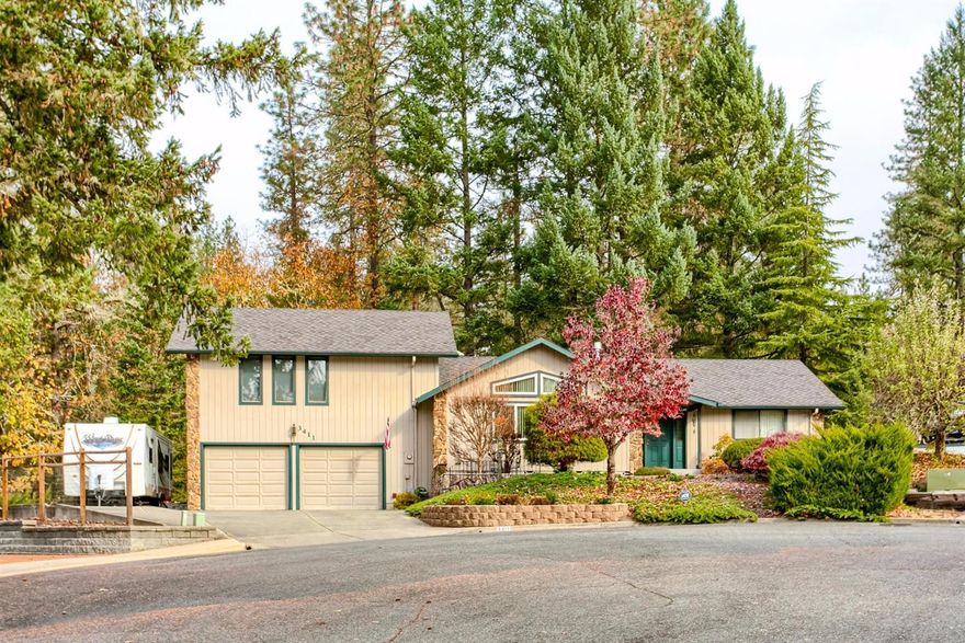 Best of Both Worlds! Close to town in a quiet cul-de-sac, but backs to over 300 acres of BLM land & Cathedral Hills trails! This lovely home is 1768 sq ft with 2 bedrooms, plus a den which could be a 3rd bedroom & 2 full baths. Features include hardwood floors, vaulted ceilings, huge windows make it light & bright, & central vac makes housekeeping a breeze. The kitchen features a breakfast bar, cook top, plus a built in grill/griddle. Relax in the large master suite with brand new carpet, walk in closet, new tile floors in the bath & dual sinks. Enjoy birds, deer, peace & quiet on the covered patio overlooking the BLM forest behind the property or venture out and walk the many trails. A great place to entertain friends & family. Access the golf course from the neighborhood just around the corner. The yard is easy maintenance, has RV parking with full-hookups & a garden shed. Close to shopping, schools & hospital. A rare find...Is this Your New Home?