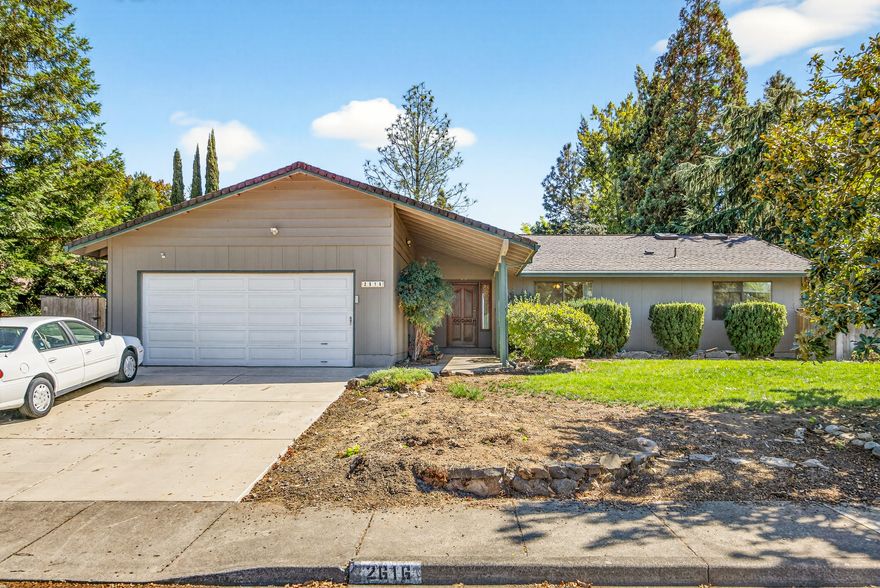 Welcome to this charming single-story home, nestled in the highly desirable East Medford neighborhood with stunning mountain views. This 3-bedroom, 2-bathroom gem offers a spacious layout perfect for family living, featuring a cozy living room, separate family room, and a wood-burning fireplace for those cool evenings. Step inside to vaulted ceilings and abundant natural lighting that create an airy, inviting atmosphere. The well-appointed laundry room provides ample storage, while the updated features include a brand-new driveway installed in 2025. Outside, entertain in style with a large yard ideal for gatherings and an inground pool equipped with a new pump. Conveniently located near shopping, restaurants, and schools, this property combines comfort, convenience, and timeless appeal—don't miss out!