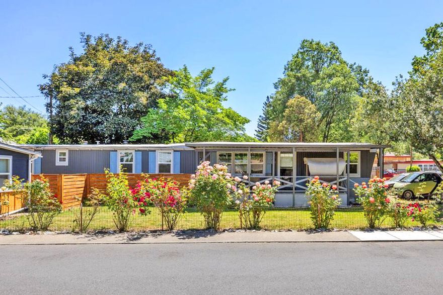 Charming 3 bedroom, 1 bath single wide home on .16 acres! Updated throughout, boasting 924 sq ft of cozy living space. Includes a front covered deck, fully fenced grass yard, 10' x 24' workshop, greenhouse, and detached 1-car garage. Perfect for those seeking comfort and functionality. Don't miss out on this gem!