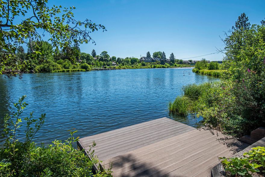 This charming and warm RIVERFRONT home is truly one of a kind with unobstructed panoramic views from inside the home and spacious decks. Wander down to the fire pit right on the river or launch your paddle boards and kayaks from the home's private dock.  An ideal family retreat offering endless options for an active destination gathering place! This home is in a prime location and allows you to walk to both downtown Bend and the Old Mill with its exceptional restaurants, parks, events, and concerts. If you have an RV or boat, there is no problem at this house with plenty of parking and no HOA's.  In the summer enjoy the water sports right off your dock. During the winter go skiing and when you get home stoke the wood burning stone fireplace and relish the peace and quiet over the river as the snow falls.  4 bedrooms 2 master suites, open floorplan  and upstairs you have a bonus area for your family. If you are looking for an enchanting, extraordinary home, look no further.