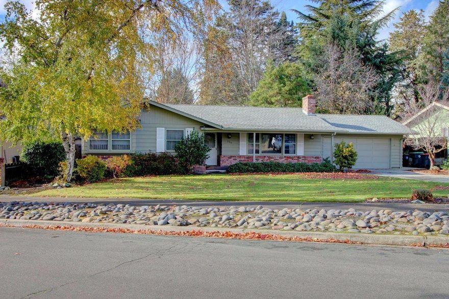 This is an outstanding opportunity to own a classic East Medford home featuring lovely mature landscaping, a great floorplan, and pride of ownership by the original owner. Located on a quiet street near the Rogue Regional Medical Center and Hoover and Hedrick schools, this clean and well-maintained 1760 sq. ft. single-level home features 3 bedrooms, 2 bathrooms, and a cozy family room with a brick fireplace. The original kitchen connects to a bright living room that provides views of the beautifully landscaped .27 acre yard with access to the backyard via a sliding door. The home has ample storage, a laundry room, a 2-car garage with built-ins that provide additional storage, and is wheelchair accessible. This wonderful home still retains its original East Medford charm, but was updated in the 90s, had a new roof installed in 2011, and has a large new driveway that could accommodate an RV or boat. 1 year home warranty being provided by the seller. Come see it today!