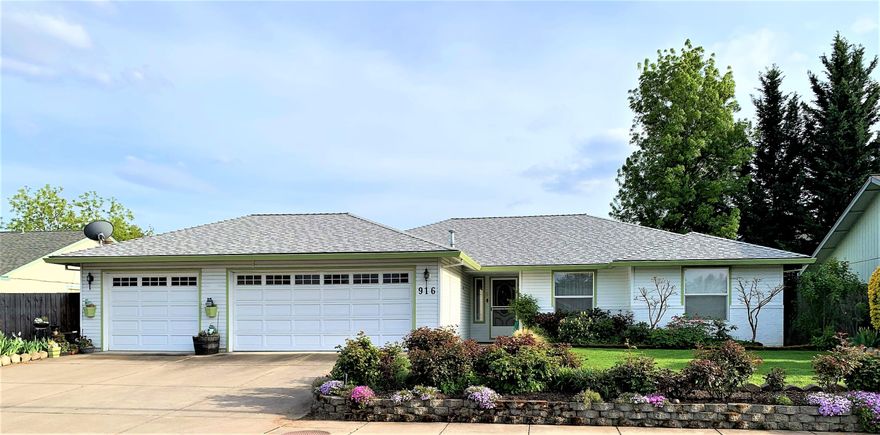 This lovingly cared for 3 bedroom, 2 bath Central Point home is conveniently located near shopping and 4 minutes from Forest Glen Park. Spacious open floor plan with large living room and sliding door that looks out on the beautiful garden area. Large dressing room in primary suite. The fully fenced backyard is beautifully kept and adorned with flowers and bushes. Inground sprinklers on timers in front and back yards. Newer roof. Three car attached garage with a drive through to the back yard.