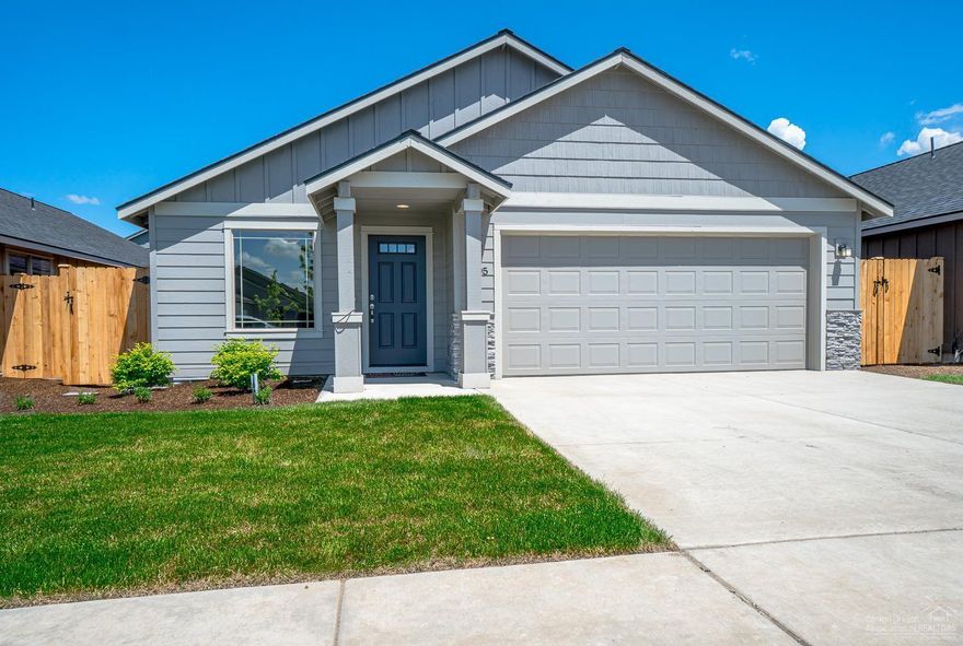 Completed in less than a month! 3 bedrooms, 2 baths, 1,662 sf w/tons of windows. Lg great room w/ cozy gas burning fire place, open to dining w/eating bar, Quartz slab counters in the Kitchen, full height custom tile back splash. SS Energy Star appliances, lg corner pantry. Den w/dbl doors off entry. Spacious bedrooms, huge walk in Master closet, dbl sinks in both baths. Natural gas, forced air high efficiency furnace, AC to be installed. Dbl garage w/cultured stone accents, covered front & back patios for year round entertaining. Front & back yard landscaped w/sprinklers, 6'cedar fence all around. Model home @ 3005 NW Cedar Ave, open 12-5pm Thurs-Mon. Photos are of staged model home which is the same floorplan but different color scheme.