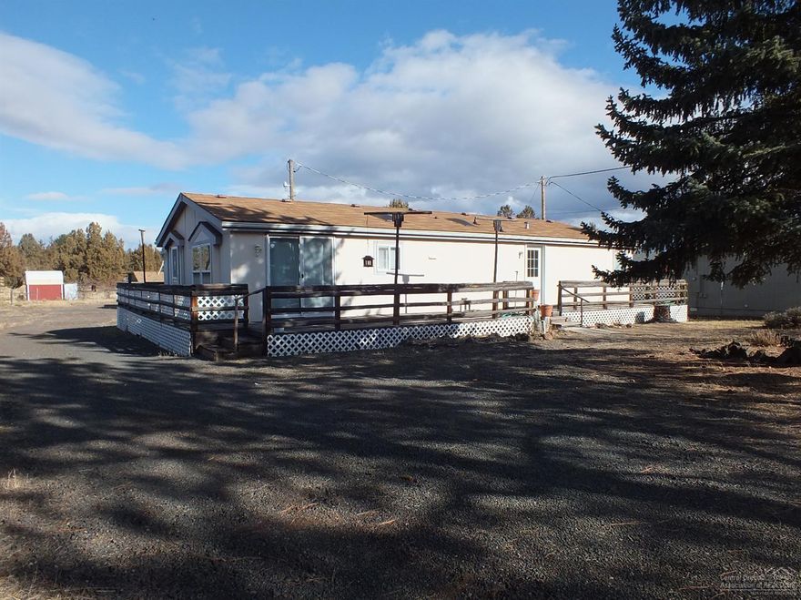 This 3 bed/2bath home with an open kitchen and living area. The master bedroom is very spacious with a large master bathroom. You can relax and enjoy a nice refreshing bath in the soaking tub. There is an auxiliary building for your hobbies of guest space. The property is very flat and usable and room or your four legged friends. Just off the paved road, you will have an easy trip to town for your shopping pleasure. Hurry, at this price it won't last. Crooked River Ranch many amenities such as golfing.