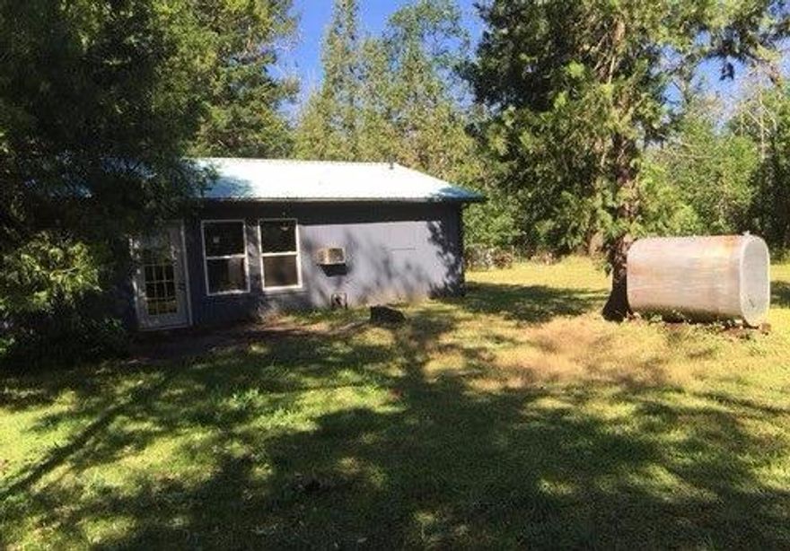 Huge 2 bedroom 1 1/2 bath home in Cave Junction with property to spare! Lots of outbuildings, oil tank, wood burning stove, indoor laundry area, this house has it all! Needs some TLC but a great home for the DIYer or flipper!