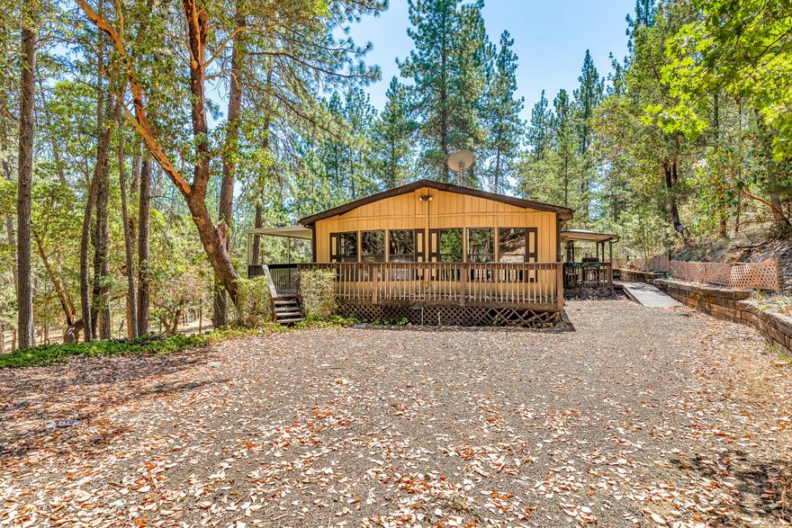 Searching to have two homes on almost 13 secluded acres? This property is rather unique with the main home being a 1987 dbl. wide manufactured home with a split floor plan featuring large, open living area, certified wood stove, spacious peninsula kitchen and vaulted ceilings. Outside is a large wrap around deck and views through the forest. All appliances are included. The second home needs some renovations. It sits on a separate tax lot and is a 696 sq. ft. manufactured home built in 1963 with an addition. There is a barn with stalls and fencing that needs some attention as well. This is a great opportunity for an energetic buyer to take advantage of a great value and establish a generational family estate on some very beautiful land. The driveway is gated and offers wonderful privacy. Financing may be difficult so cash may be your only option for purchase. Call today for a private showing.