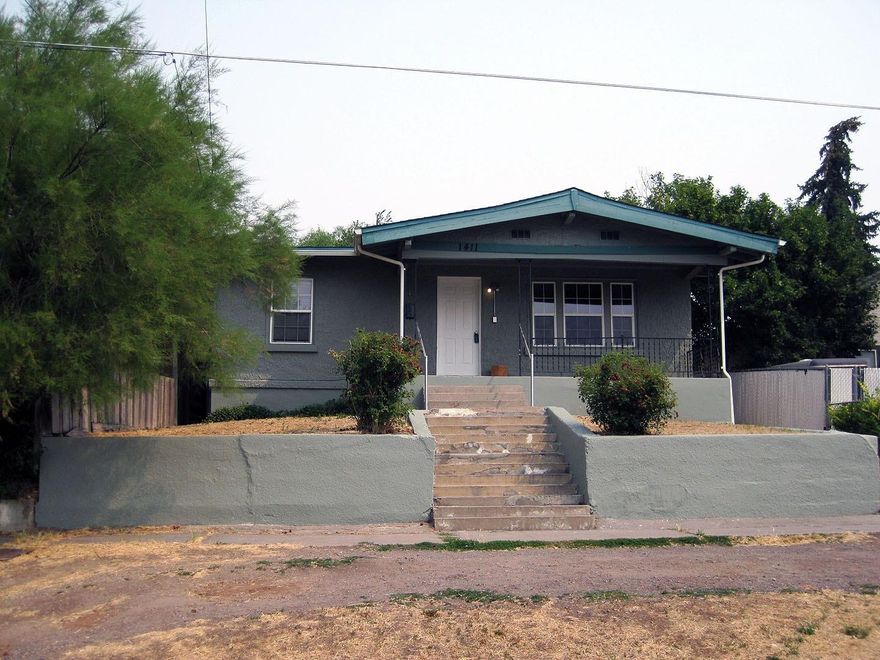 This well-maintained home has the charm of original hardwood floors, built-ins and arched doorways. It has had many updates, including a new bathroom tub and vanities. There is a large eat-in kitchen, large living room, and vinyl windows throughout. The downstairs basement features 2 bedrooms and a family room along with laundry, all on concrete floors. The roof is about ten years old and there is gas forced-air heating throughout. A great property for a first-time buyer or investor!