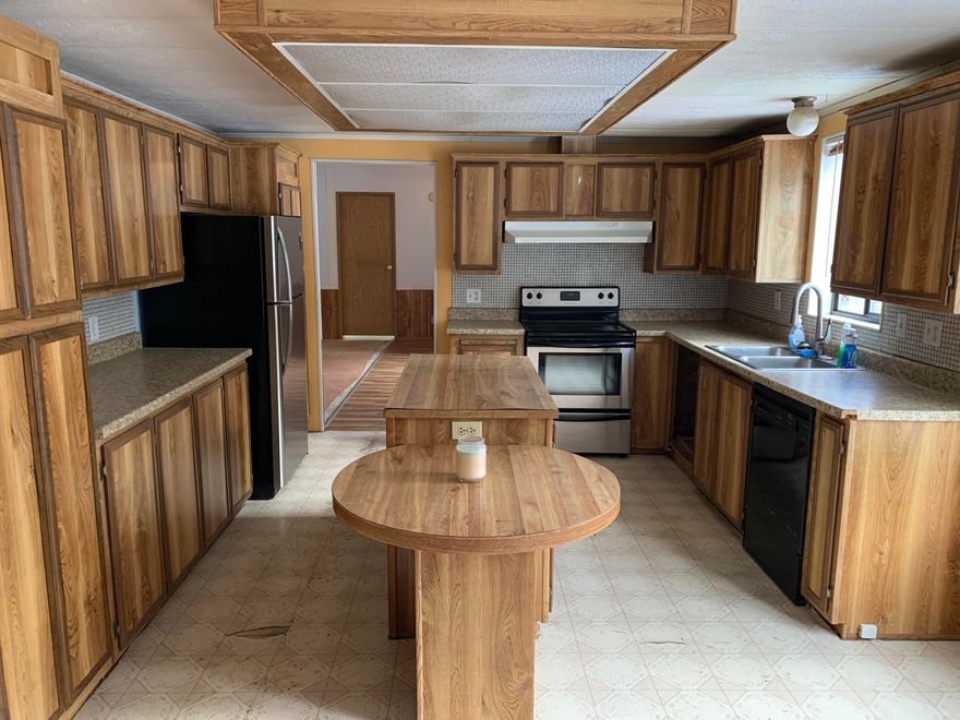 Act fast on this well priced 'contractors special'. Bring your skills and improvements to build quick sweat equity. Large (approx. 20' X 40') shop with three garage doors. Nice single level floor plan is laid out well, with good separation between Master bedroom and other bedrooms. Huge Master bathroom with a jetted tub and a large shower. Nice covered porch is overlooking the rear yard and playground. Enjoy the large Ponderosa Pines and expansive lot, giving you privacy and the country feel!   The large fenced property is on a paved street and also has access off the back road for pull through access. This home is relatively close to downtown and many of Bend's amenities. This is a popular neighborhood for families and to have property with close to shopping and dinning options. Priced to sell quickly; Estate sale.