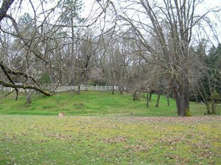 Beautiful level 2.38 acres w/3 seasonal creeks, pretty trees & nice grounds on the corner of Old Stage & Colonial. Previously there was a manufactured home that is now gone. Existing septic system & well log @ 26gpm. Fruit trees, grapes and fully fenced for animals. (fences need work) Easy access to I-5 and minutes to the Rogue River & Laurel Hills Golf Course.