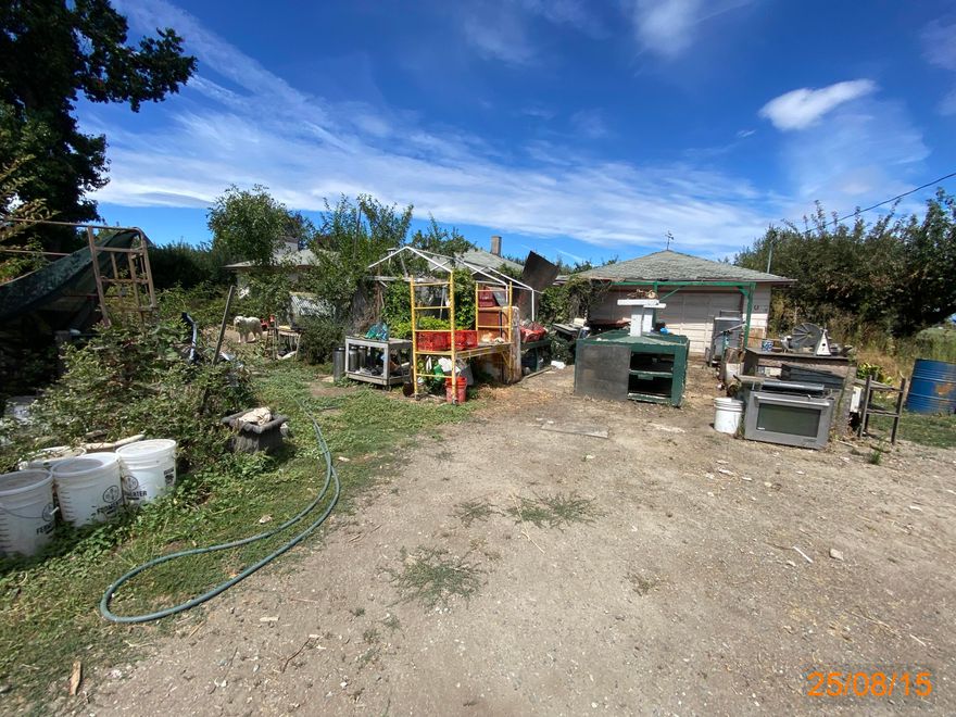 Orchard of fruit trees & 3 wells per previous listing. Public sewer. 1.5+ miles to historic Jacksonville, listed as the most charming town in Oregon, & all of its renowned restaurants, shops, hiking trails, Brit festival concerts, & wine. No neighbors & a large farming parcel to the north & east permit excellent territorial views. This property is part of a 1st Look program. It allows owner occupant buyers to have their offers negotiated on day 8 of being listed. Owner occupants are those buyers that will occupy the property as their principal residence w/in 60 days of closing & will maintain their occupancy for at least 1 year. These buyers are required to sign an Owner Occupant Certification. An investor, trust, vacation or part-time residence, or purchasing for another person will be considered an investor & are not eligible for 1st Look. Investor offers are negotiated on day 31 of listing. Sold occupied, As-Is, sight unseen at auction & cash only. Do not trespass. See Instructions