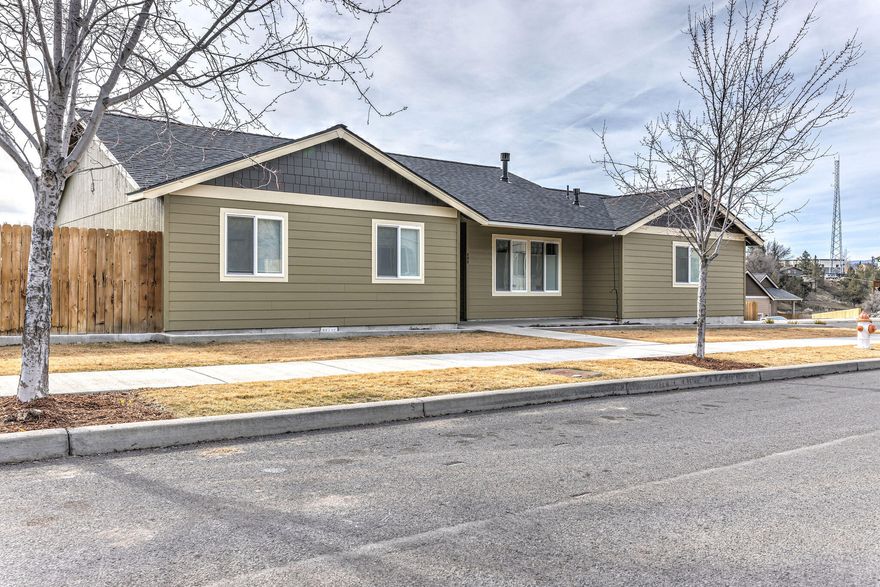 This is a must-see home featuring 1476 SF, 3 bedrooms and 2 bathrooms. Open living with vaulted ceilings, custom floors throughout, and gas fireplace for our Central Oregon evenings. Light and bright island kitchen with solid surface counter tops, stainless appliances, and gas range for the family chef. Large primary suite with walk-in closet, double vanity sinks, and walk-in shower. Corner lot with RV parking and double garage to store the toys.