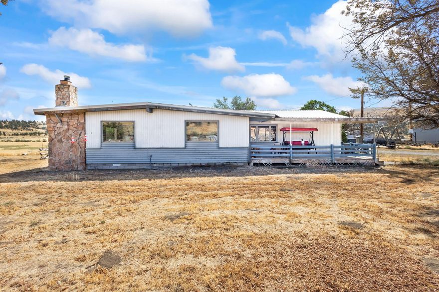 Incredible opportunity to own a sprawling 140.13 -acre property featuring a charming 3-bedroom, 2-bath home with a cozy rock fireplace. This property boasts a massive 7,500 sq. ft. shop with 20-ft eaves, 2-ton cranes, and a robust 440 electrical setup—perfect for large projects. 8x20 walk-in Cooler. A second 864 sq. ft. shop, a 2,000 sq. ft. hay barn, and a 3,960 sq. ft. machine shed with an additional hay barn. Water is abundant, with two wells (one 145 feet deep producing 350 gallons per minute and the home well produces 10 gallons a minute ), a natural spring, and water rights to Antelope Creek. The land offers excellent farm soil with no rocks, perfect for cultivation. Wildlife enthusiasts will enjoy frequent visits from deer and elk. Located just 20 minutes from Madras, the property is ready for expansion with infrastructure in place for two additional homes or farmworker dwellings, previously used for mobile homes. Don't miss this rare chance to own a well-equipped, versatile f