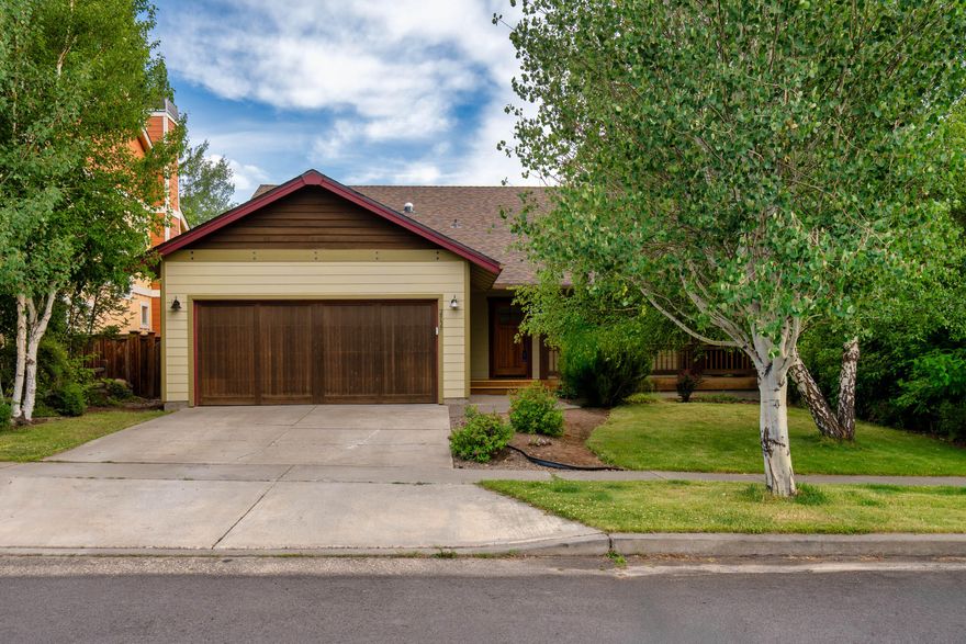 Discover this well maintained Craftsman-style home in one of NW Bend's most desirable neighborhoods. This single-level gem offers 1,680 SF, 3 bedrooms, 2 bathrooms, and an open floor plan with vaulted ceilings that create a bright and spacious feel throughout. Enjoy the inviting wrap-around front porch, mature landscaping, and a private backyard—perfect for relaxing or entertaining. The well-designed layout seamlessly connects the living, dining, and kitchen areas, offering both comfort and functionality. Additional features include an attached two-car garage with 350 square feet of storage accessed by a large pull down ladder. This home is in close proximity to incredible schools, Shevlin Park, Discovery Park, NW Crossing amenities and everything NW Bend has to offer. It is a must-see! See attached List of Features for recent upgrades. Roof, hot water tank, and furnace have been updated in the last 3 years.