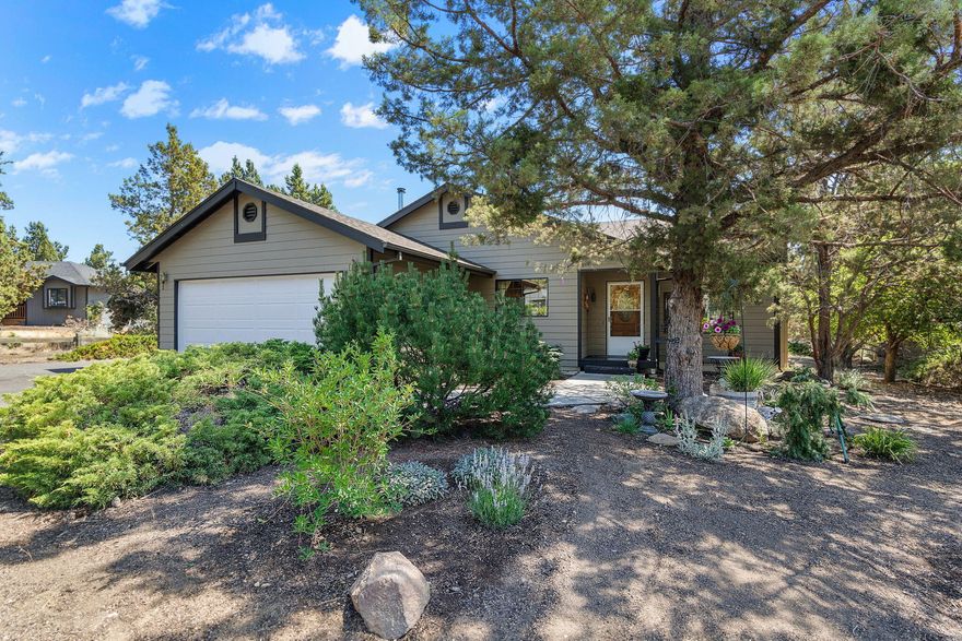 Situated in the desirable South Heights Community, this home offers the charm of country living w/a convenient location close to amenities, schools, airport & just a quick drive to Bend. Vaulted great room layout w/wood look laminate floors throughout, plenty of open space to gather & entertain. Cozy kitchen with cooktop, wall oven, refrigerator & a sink w/a view of the front garden. Primary Ste is set away from 2 guest rooms & features a private bath w/dbl sinks, sky light, walk in closet & step in shower. Add'l bath is situated between the 2 bedrooms & is well appointed w/new vanity & granite counter. Laundry room w/storage space & washer & dryer included. Attached dbl car garage, storage building & tons of parking for your RV & toys. Fenced garden & accompanying greenhouse for those who love gardening - OR space could be utilized for a shop or ADU! Freshly stained deck off the living area to enjoy year round, water wise landscaping & rock outcroppings. Don't miss!