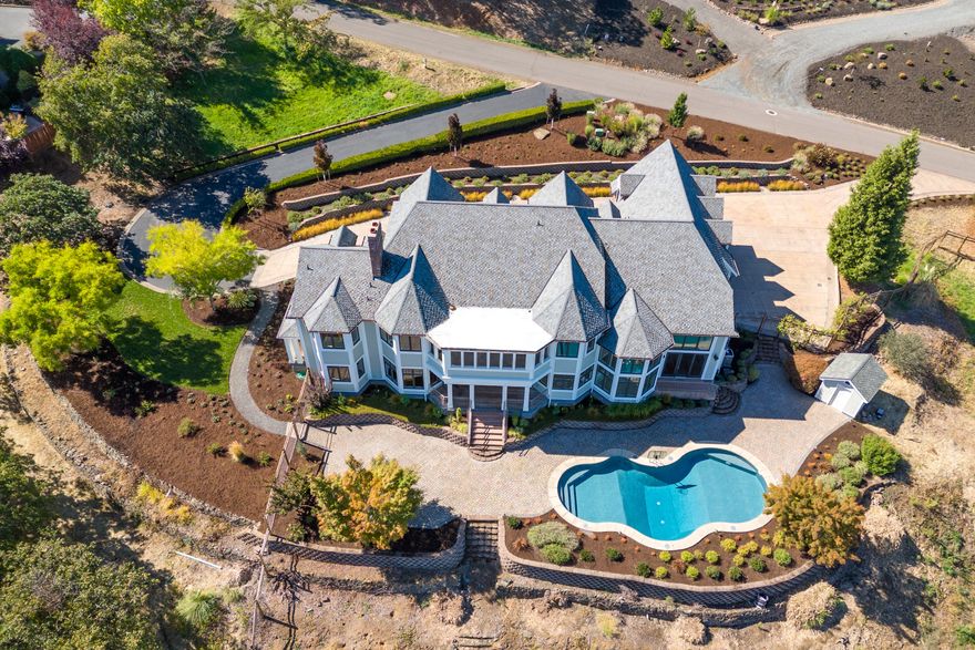 First time on the market, beautiful French country, modern architecture w/all city services on 2 prime tax lots for a total of 2 acres. Views of the Mts, City & Valley below. In-ground heated pool w/water feature. 5 en-suites + 1 extra bedroom, 2 offices, soaring ceilings, floor to ceiling windows, hardwood & stone tile floors & 2 staircases. Beautiful kitchen w/ new Wolf dbl oven & convection oven, 5 burner gas cooktop, subzero fridge w/ separate addl 2 cabinet refrigerated drawers, walk-in pantry, large island, lots of storage, butler pantry w/wet bar, formal dining room w/gas/wood fireplace, stone and hardwood floors. Primary suite has gas/wood fireplace w/balcony overlooking the amazing view, water closet, double sinks, soaking tub, walk-in large tile shower & 2 walk-in closets. 3 car oversize garage w/storage. New exterior & interior paint w/ many new updates. Beautiful landscaping w/paved circle driveway Stunning home in every way.