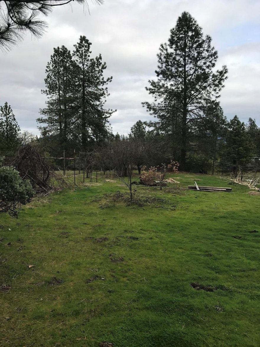 Beautiful, Flat, Sunny, 7.26 acres with older manufactured home.