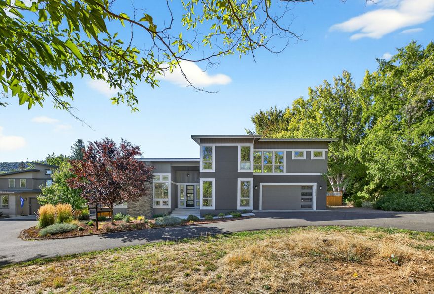 Style meets sophistication with this stunning contemporary style home on a private shared drive with a lovely country setting. Earth Advantage Certified, quality built in 2017, this home has so much to offer! Open floor plan, many strategically placed windows to enjoy the amazing views, and allow for abundance of natural light. The gourmet kitchen is a chef's dream, complete with granite countertops, an expansive eating bar, and custom-painted cabinetry. Kitchen overlooks the impressive great room with soaring ceiling, gas fireplace and attractive wood flooring throughout. Main level primary suite has a walk-in closet, dual vanities, soaking tub and glass enclosed shower. Also on the main level is an additional 2nd bedroom/ office and full bath. Upstairs, you'll find two additional bedrooms, full bath, and a spacious versatile bonus room. Large .39 acre lot, fully fenced backyard has raised garden beds & TID irrigation rights. Great location within the Bellview School attendance zone.