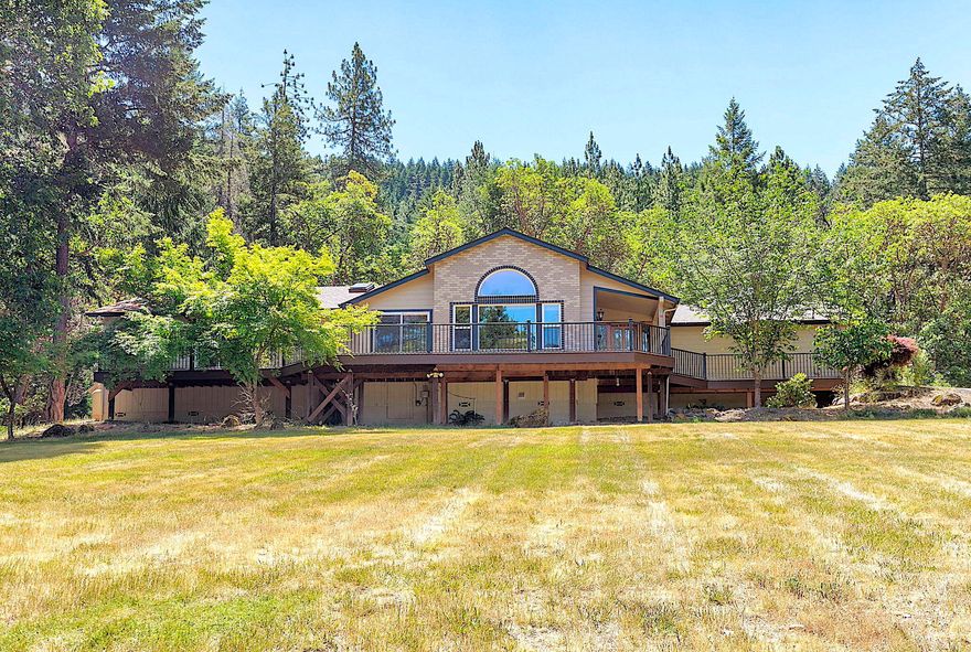 Welcome to 480 Surrey Drive. This stunning custom home is perched on a hill at the end of a tranquil road and offers a spacious floor plan with strategically placed windows that showcase breathtaking mountain views! The living room boasts vaulted ceilings and a gas fireplace, creating a cozy and inviting atmosphere. The recently remodeled kitchen features exquisite granite countertops and rich dark alder cabinets, providing ample storage and functionality. The dining room is perfectly situated with French doors that lead to the back patio, ideal for indoor-outdoor living. The expansive primary bedroom includes an en suite bathroom and a large walk-in closet. It also has direct access to an extensive deck, perfect for savoring beautiful summer sunrises and sunsets. Two additional bedrooms and a guest bathroom complete this home. Additional highlights include a paved driveway, mature landscaping, garden area, and a large shed. All this to enjoy in a private setting on an acre of land!